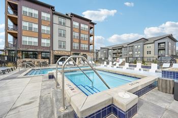 Large swimming pool in front of our buildings